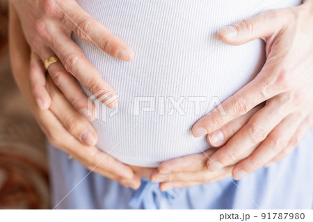 Pregnant couple belly hands. Happy pregnancy woman and husband hugging pregnant belly. Concept of pregnancy, maternity, expectation for baby birth. Pregnant couple belly hands. Happy pregnancy woman and husband hugging pregnant belly. Concept of pregnancy, maternity, expectation for baby birth. 91787980