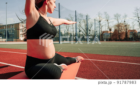 Pregnancy health. Prenatal healthy fitness active fit gym outside. Pregnant woman training yoga sport exercise. Pregnancy yoga exercise. Pregnancy health. Prenatal healthy fitness active fit gym outside. Pregnant woman training yoga sport exercise. Pregnancy yoga exercise. 91787983