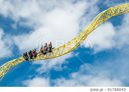 Ride roller coaster in motion in amusement park. 91788040