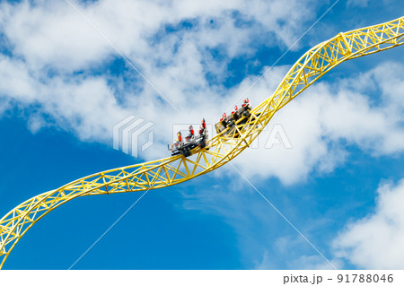 Ride roller coaster in motion in amusement park. 91788046