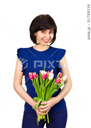 A woman with a bouquet of flowers on her birthday. Isolated, white background 91789316