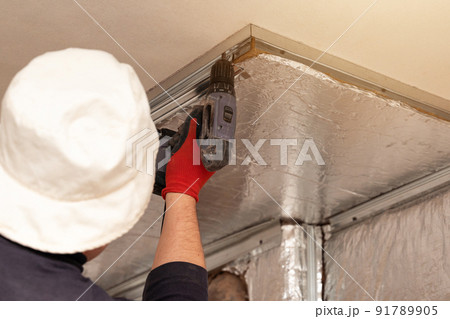 Mineral wool with foil, thermal protection for the wall from the fireplace, installation of metal beacons, screwing the beacons to the wall with a screwdriver. 91789905