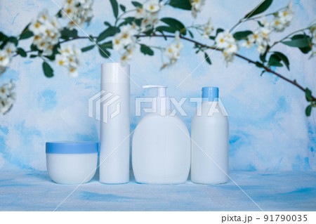 A set of white, plastic, containers. Packaging, bottle template for cosmetics, antiseptic, with detergents and chemical cleaners, for medical and cosmetic products. White and blue background with A set of white, plastic, containers. Packaging, bottle template for cosmetics, antiseptic, with detergents and chemical cleaners, for medical and cosmetic products. White and blue background with 91790035
