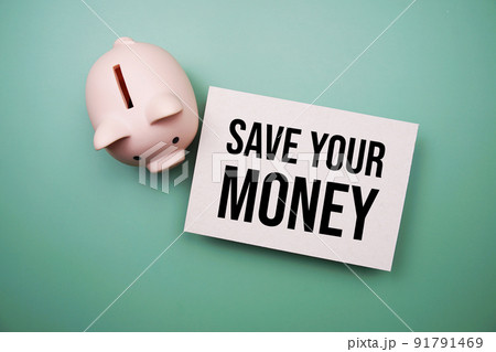 Save Your Money text message and piggy bank on green background 91791469