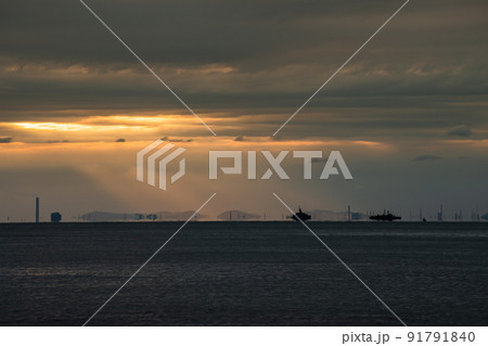 Wide seascape with orange sun set beam lighting. 91791840
