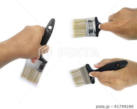 hand holding Paintbrush isolated on white background 91799286