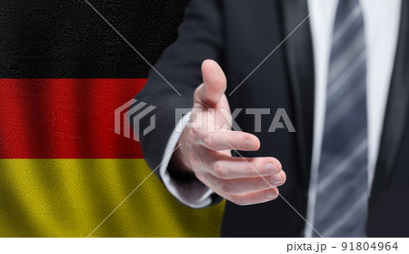 German business, politics, cooperation and travel concept. Hand on flag of Germany background. German business, politics, cooperation and travel concept. Hand on flag of Germany background. 91804964
