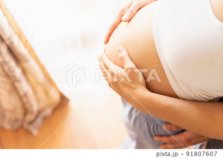 Pregnant belly hands. Happy pregnancy woman and husband hugging pregnant belly. Concept maternity, pregnancy, childbirth. 91807607