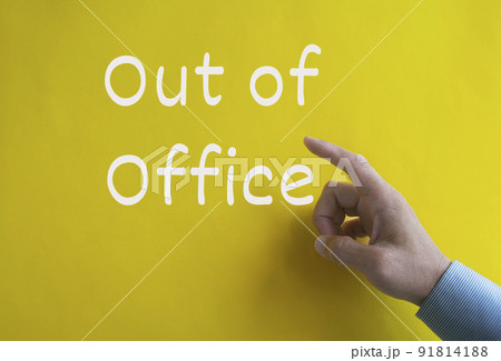 Out of office text on yellow cover background. Business and out of office concept Out of office text on yellow cover background. Business and out of office concept 91814188