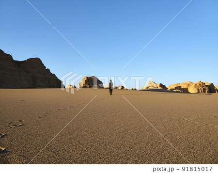 rear view of asian woman female tourist walking in national geological park near dunhuang, gansu province, china rear view of asian woman female tourist walking in national geological park near dunhuang, gansu province, china 91815017