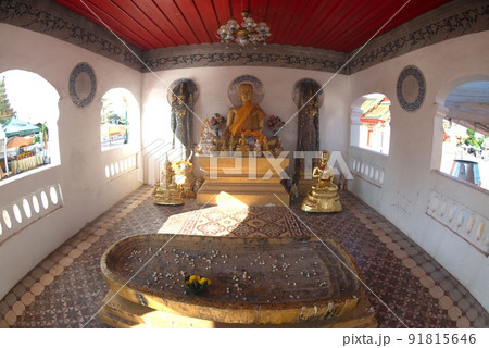 Group of ancient Buddha images, including standing Buddha images, sitting Buddha images and the footprint of the Buddha enshrined inside the Wat Phra That Choeng Chum Worawihan It is an important. Group of ancient Buddha images, including standing Buddha images, sitting Buddha images and the footprint of the Buddha enshrined inside the Wat Phra That Choeng Chum Worawihan It is an important. 91815646