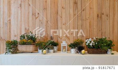 flowers decorate on the dinning long table in the luxury relax event with the wood plate background. flowers decorate on the dinning long table in the luxury relax event with the wood plate background. 91817671