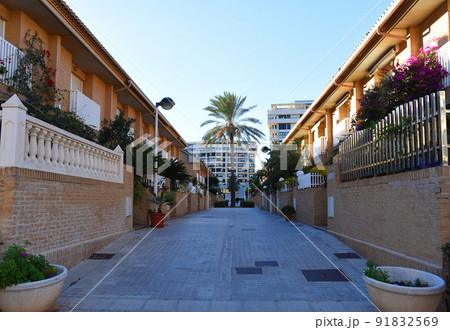 Brick house with palm trees in yard on street. Home with apartments at Alboraia 91832569