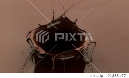 Melted chocolate splash in detail. 91833147