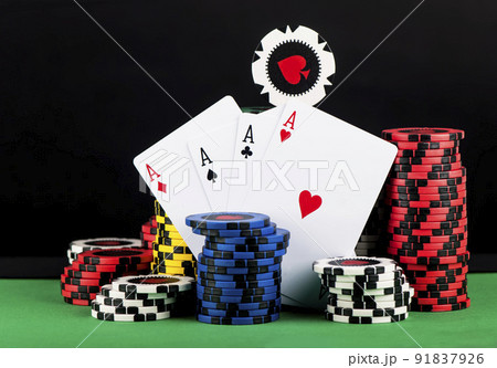 Poker Chips on a green gaming table. Poker Chips on a green gaming table. 91837926