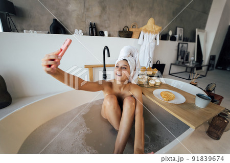 Brunette doing her sexy photo while taking bath Brunette doing her sexy photo while taking bath 91839674