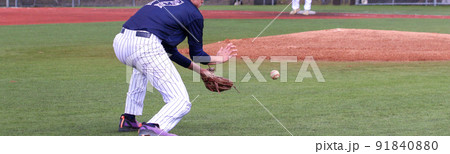 Baseball third baseman making a play on the infield Baseball third baseman making a play on the infield 91840880