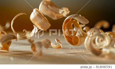 Freeze motion of falling sawdust, macro shot. 91846591