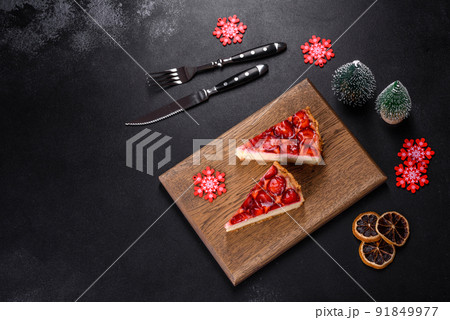 Delicious christmas strawberry tart on concrete background, top view, copy space Delicious christmas strawberry tart on concrete background, top view, copy space 91849977