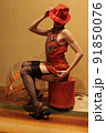 Seductive Lady in Red dress and hat 91850076