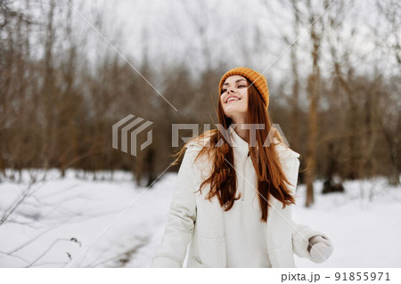 woman in winter clothes in a hat fun winter landscape fresh air woman in winter clothes in a hat fun winter landscape fresh air 91855971