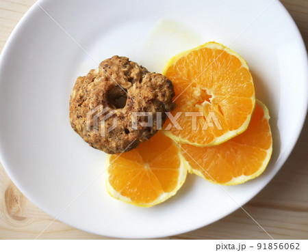 Chocolate chip cookies with orange slices 91856062