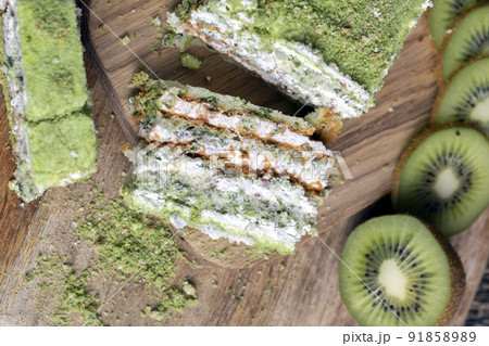 sliced green kiwi on a cutting board 91858989