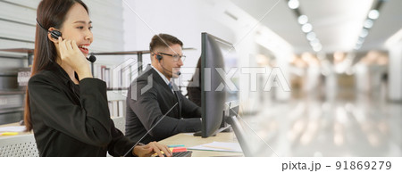 Business people wearing headset working in office broaden view Business people wearing headset working in office broaden view 91869279