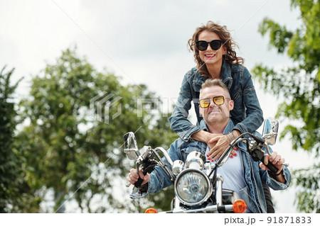 Mature Couple Riding Motorbike Mature Couple Riding Motorbike 91871833