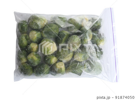Frozen Brussels sprouts in plastic bag isolated on white, top view. Vegetable preservation Frozen Brussels sprouts in plastic bag isolated on white, top view. Vegetable preservation 91874050