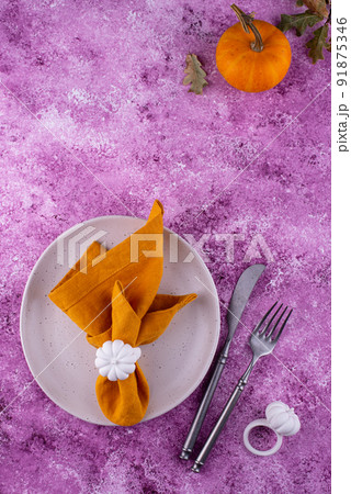 Table setting on lilac concrete background 91875346