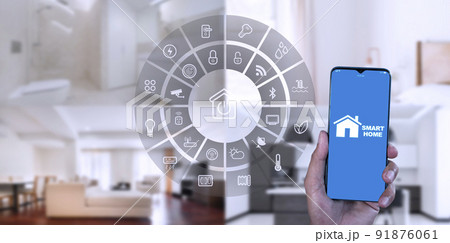 Man hand show smartphone smarth home GUI control every room in house. Hand use smart screen smart home automation assistant on a virtual screen and a user touching a button 91876061