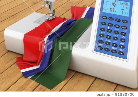 Sewing machine with Gambia flag on the wooden table. 3D rendering Sewing machine with Gambia flag on the wooden table. 3D rendering 91880700