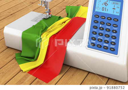 Sewing machine with Rastafarian flag on the wooden table. 3D rendering Sewing machine with Rastafarian flag on the wooden table. 3D rendering 91880752