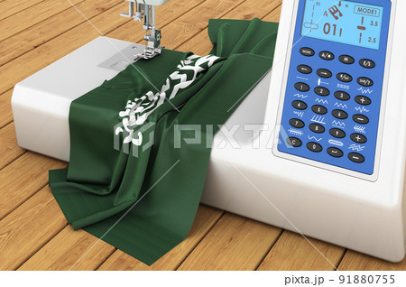 Sewing machine with Saudi Arabian flag on the wooden table. 3D rendering Sewing machine with Saudi Arabian flag on the wooden table. 3D rendering 91880755