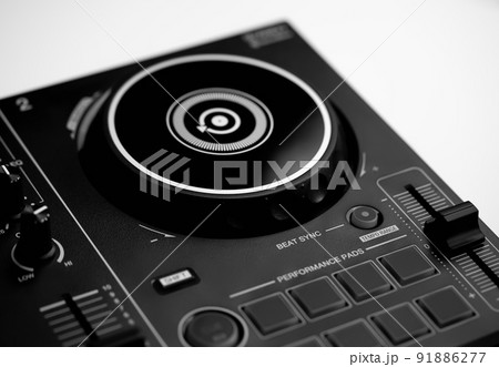 DJ mixing deck Controller connecting to Laptop and tablet using USB cable. DJ mixing deck Controller connecting to Laptop and tablet using USB cable. 91886277