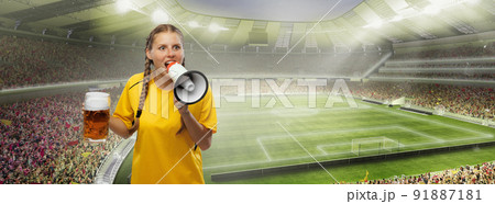 Excited woman holding beer mug and supports favorite team over crowded stadium. Soccer fans, competition, sport, oktoberfest concept 91887181