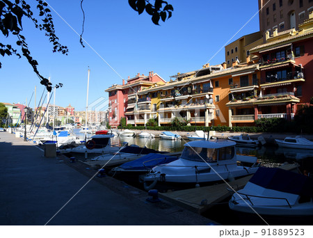 Jetty with yacht. Yachts and motor boats in marina Port Saplaya, Valencia. Jetty with yacht. Yachts and motor boats in marina Port Saplaya, Valencia. 91889523