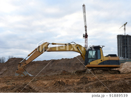 Excavator on earthmoving at construction site. Excavator on earthworks Excavator on earthmoving at construction site. Excavator on earthworks 91889539
