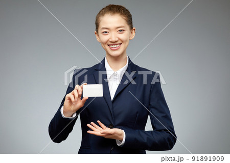 Asian Woman Holding Business Card Asian Woman Holding Business Card 91891909