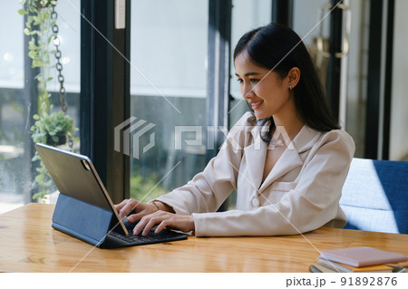 Budget, finance, woman marketer is using tablet computer for document analysis to manage investment planning risks for the company they work for. 91892876