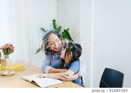 Asian portrait, grandchild granddaughter grandma grandmother and granddaughter happily join in activities to enhance skills for grandchildren. 91893364