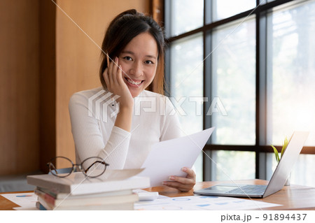 accountant, Auditor, Self-Employed, Finance and Investment, tax calculation and budget, Portrait of Asian female entrepreneur using a calculator to calculate. Company business results document. accountant, Auditor, Self-Employed, Finance and Investment, tax calculation and budget, Portrait of Asian female entrepreneur using a calculator to calculate. Company business results document. 91894437