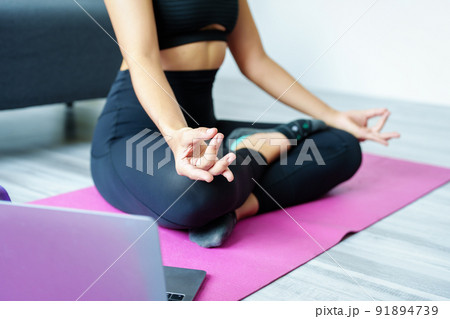 stress relief, muscle relaxation, breathing exercises, exercise, meditation, portrait of Young Asian woman relaxing her body from office work by practicing yoga by watching online tutorials stress relief, muscle relaxation, breathing exercises, exercise, meditation, portrait of Young Asian woman relaxing her body from office work by practicing yoga by watching online tutorials 91894739