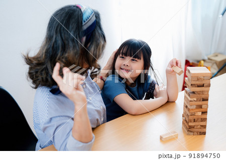 Asian portrait, grandchild granddaughter grandma grandmother and granddaughter happily join in activities to Block wood game Puzzle and enhance skills for grandchildren. Asian portrait, grandchild granddaughter grandma grandmother and granddaughter happily join in activities to Block wood game Puzzle and enhance skills for grandchildren. 91894750