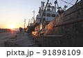 Old abandoned fishing boat at sunset 91898109