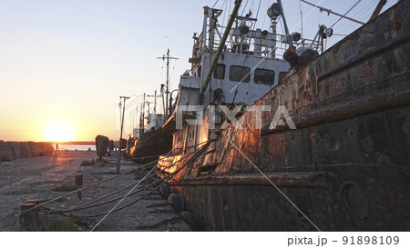 Old abandoned fishing boat at sunset Old abandoned fishing boat at sunset 91898109
