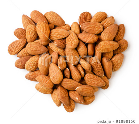 Almond lined a heart close-up on a white background. top view Almond lined a heart close-up on a white background. top view 91898150