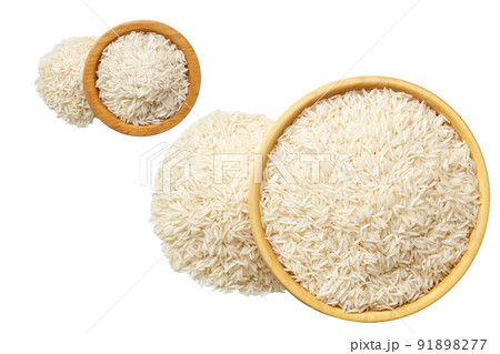 Raw white rice in a wooden plate isolated on white background top view. Raw white rice in a wooden plate isolated on white background top view. 91898277