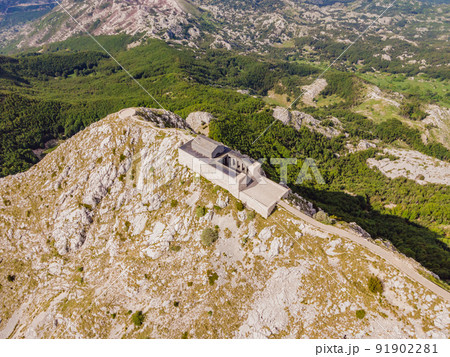 Montenegro. Lovcen National Park. Mausoleum of Negosh on Mount Lovcen. Drone. Aerial view. Viewpoint. Popular tourist attraction. Petar II Petrovic-Njegos mausoleum on the top of mount Lovchen in Montenegro. Lovcen National Park. Mausoleum of Negosh on Mount Lovcen. Drone. Aerial view. Viewpoint. Popular tourist attraction. Petar II Petrovic-Njegos mausoleum on the top of mount Lovchen in 91902281